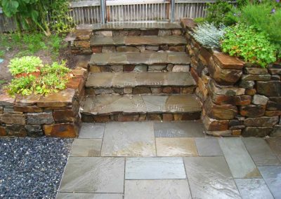 Informal stone treads give a craffsman feel to these steps